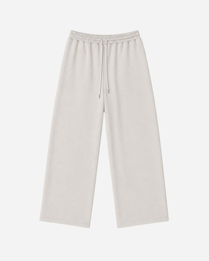 Light-colored wide-leg pants with an elastic waistband and drawstring.
