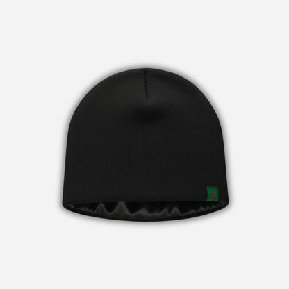 Black beanie with a logo on a light gray background