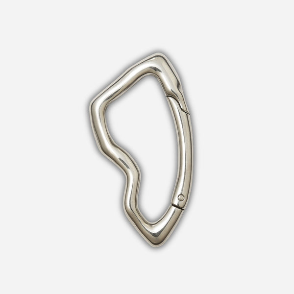 Silver carabiner on a light gray background