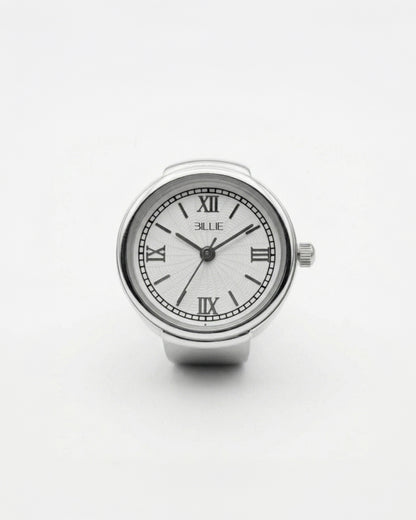 Silver watch with a white face and Roman numerals on a plain background.