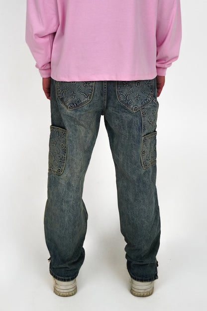 Person wearing a pink sweatshirt and blue jeans on a white background