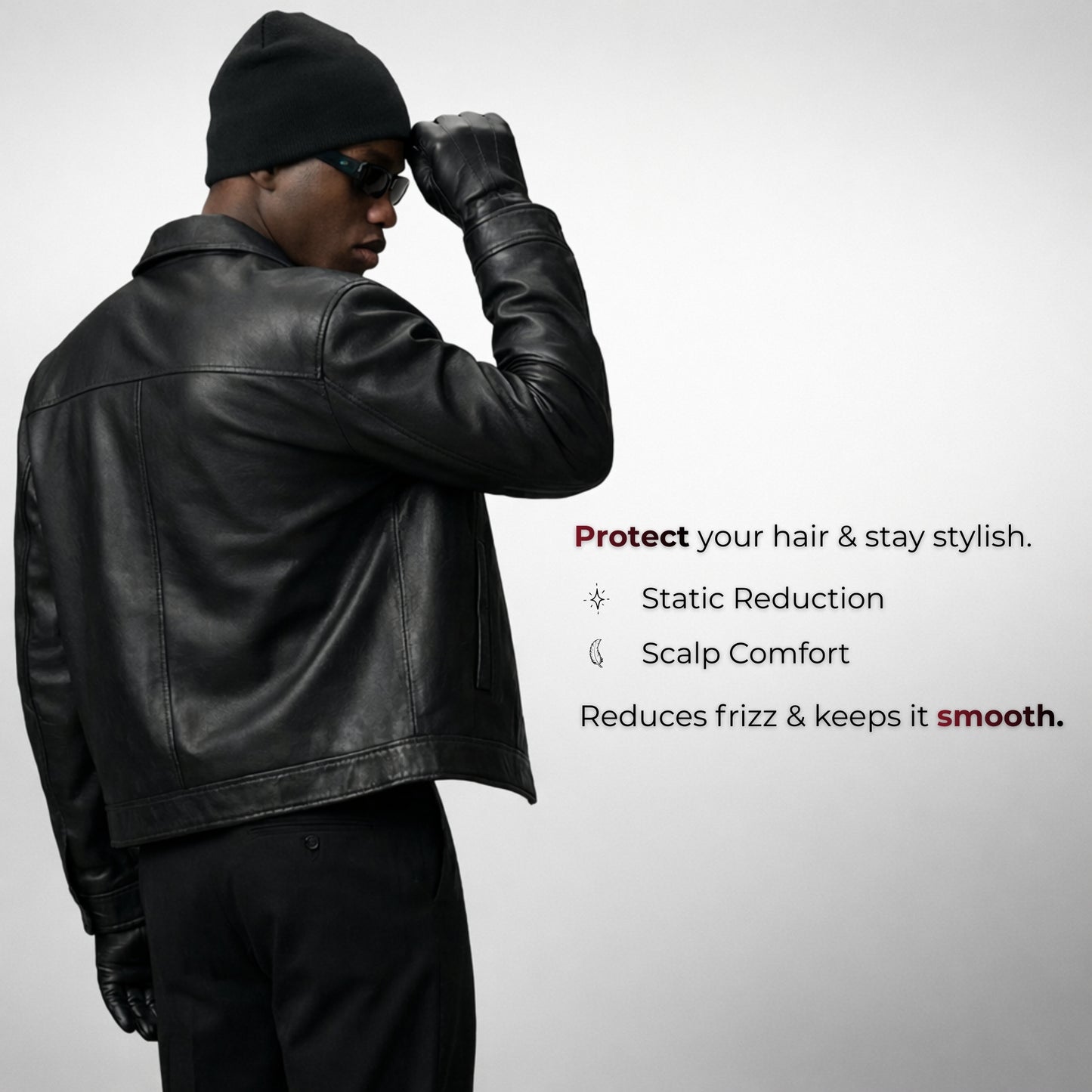 Man wearing a black leather jacket and hat with text about hair care product benefits on a gray background