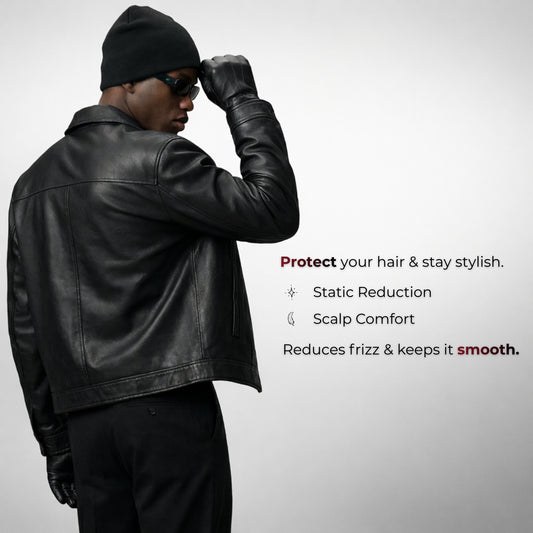 Man wearing a black leather jacket and hat with text about hair care product benefits on a gray background