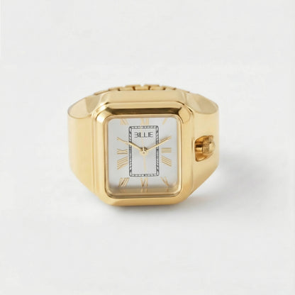 Gold ring with a white face and 'Billie' branding on a light gray background