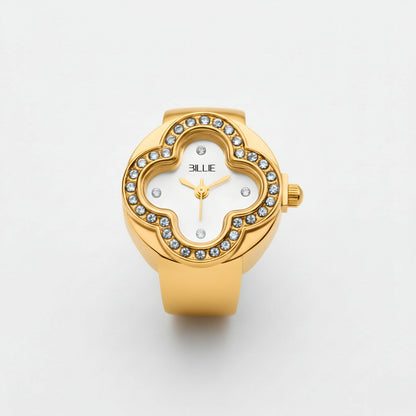 Gold watch with gemstone accents on a white background