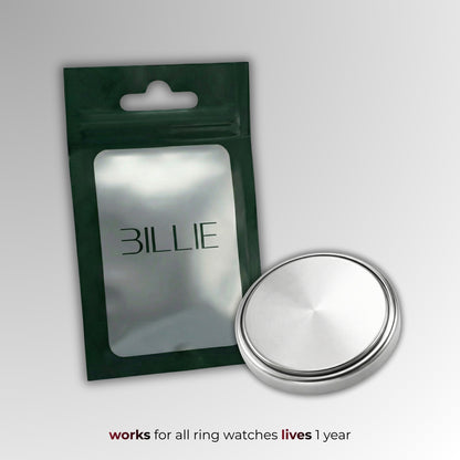 Silver circular object with 'BILLIE' packaging on a gray background