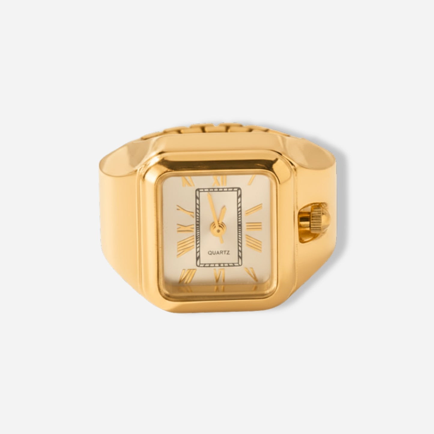 Gold ring watch with a square face on a light gray background