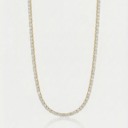 Gold tennis chain on white background