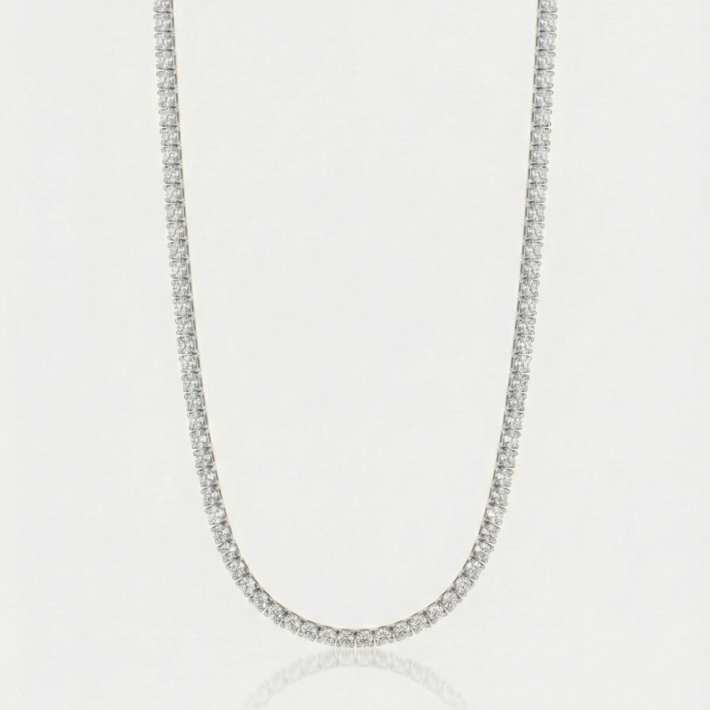 Diamond necklace on a light gray background