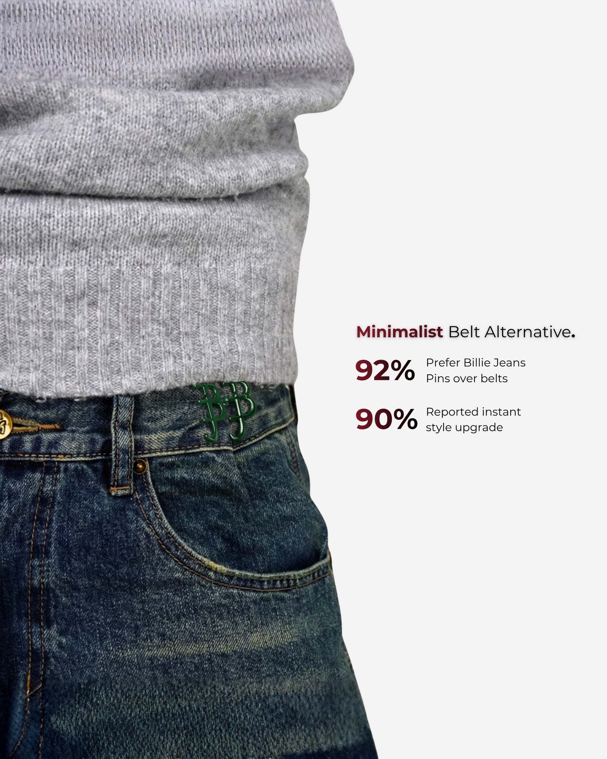 Close-up of a gray sweater and denim jeans with visible pins and text.