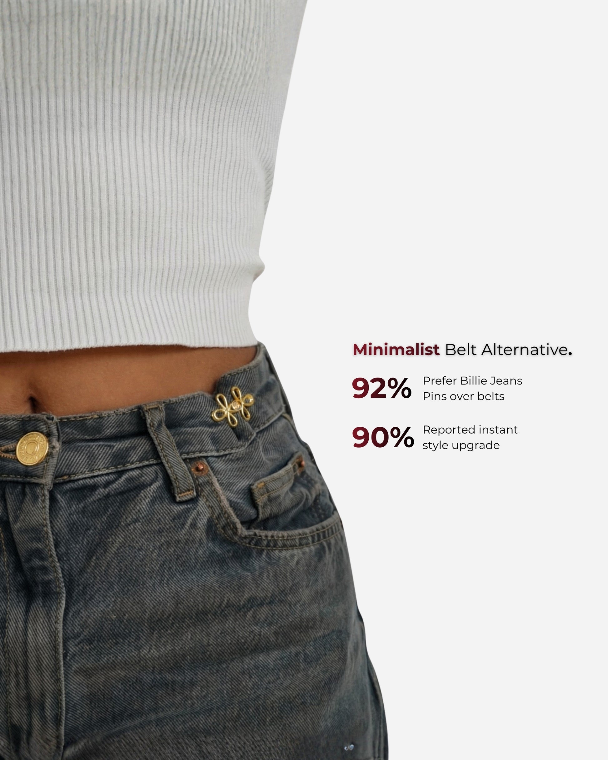 Close-up of a waist with a pin on jeans and a ribbed top.