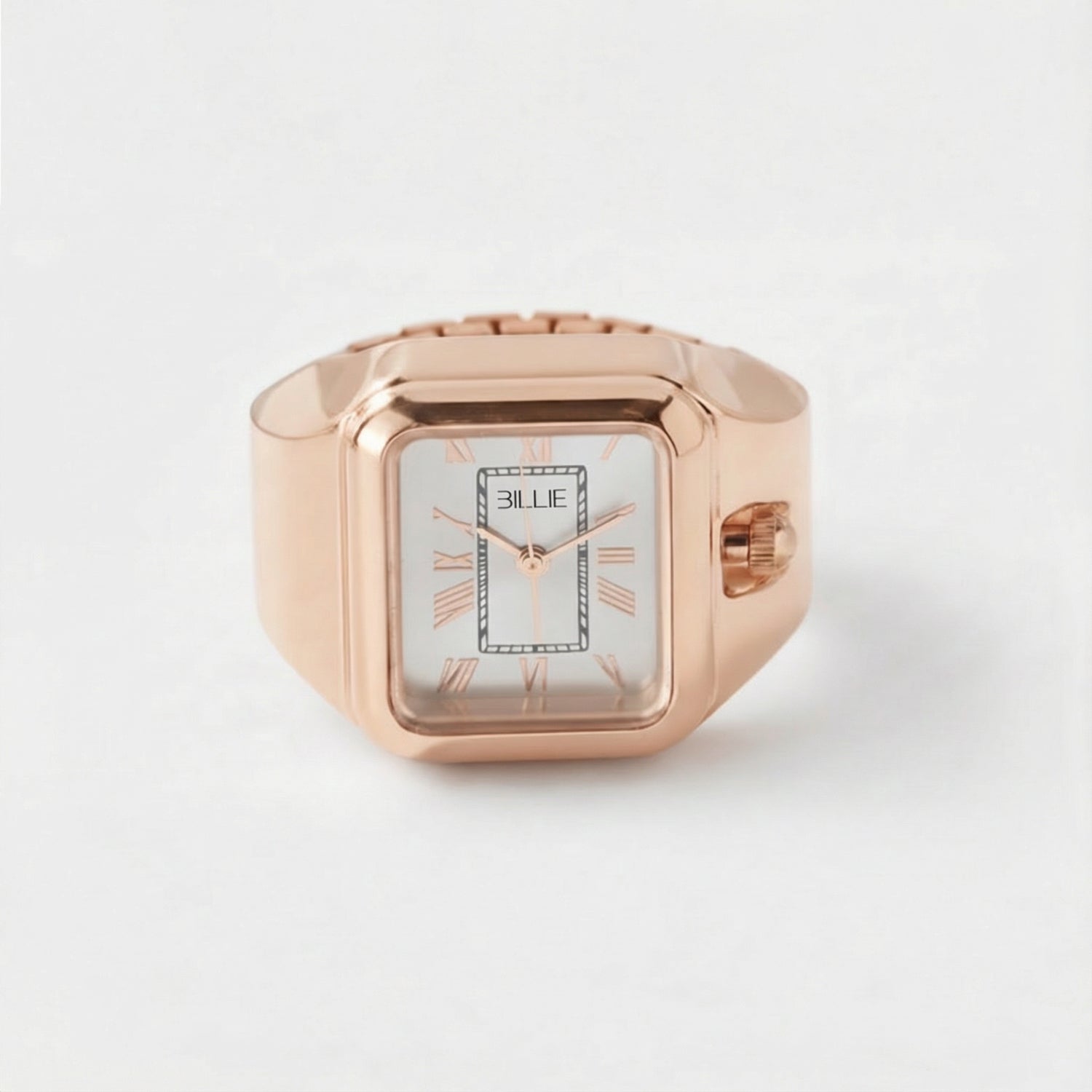 Rose gold ring with a watch face on a white background