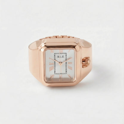 Rose gold ring with a watch face on a white background