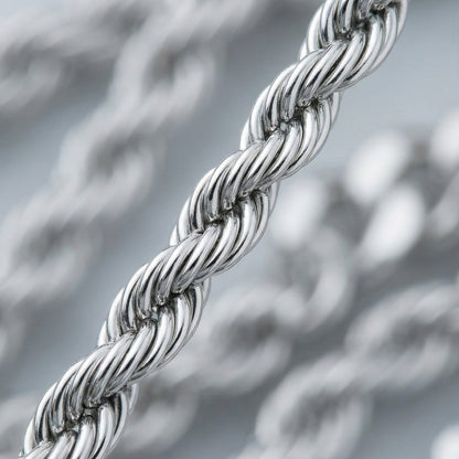 Close-up of a silver rope chain with a blurred background