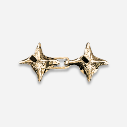 Pair of gold Waist Knots on a light gray background