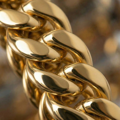 Close-up of a gold chain with a blurred background