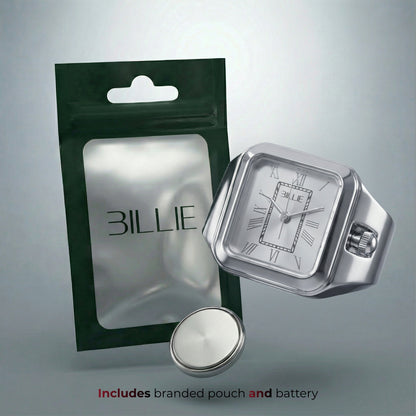 Silberne Uhr mit „BILLY”-Logo und Markenbeutel auf grauem Hintergrund