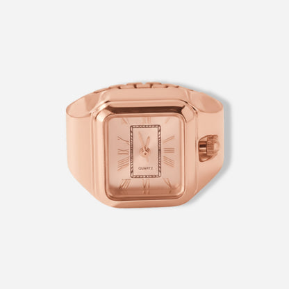 Rose gold ring watch on a light gray background