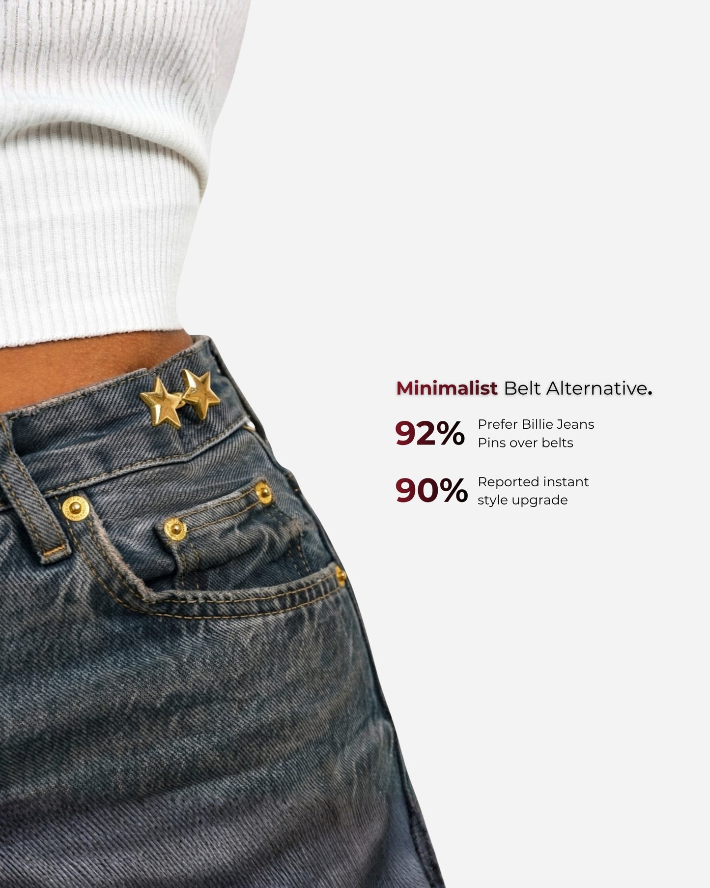 Close-up of denim with star pins and text on a light background.