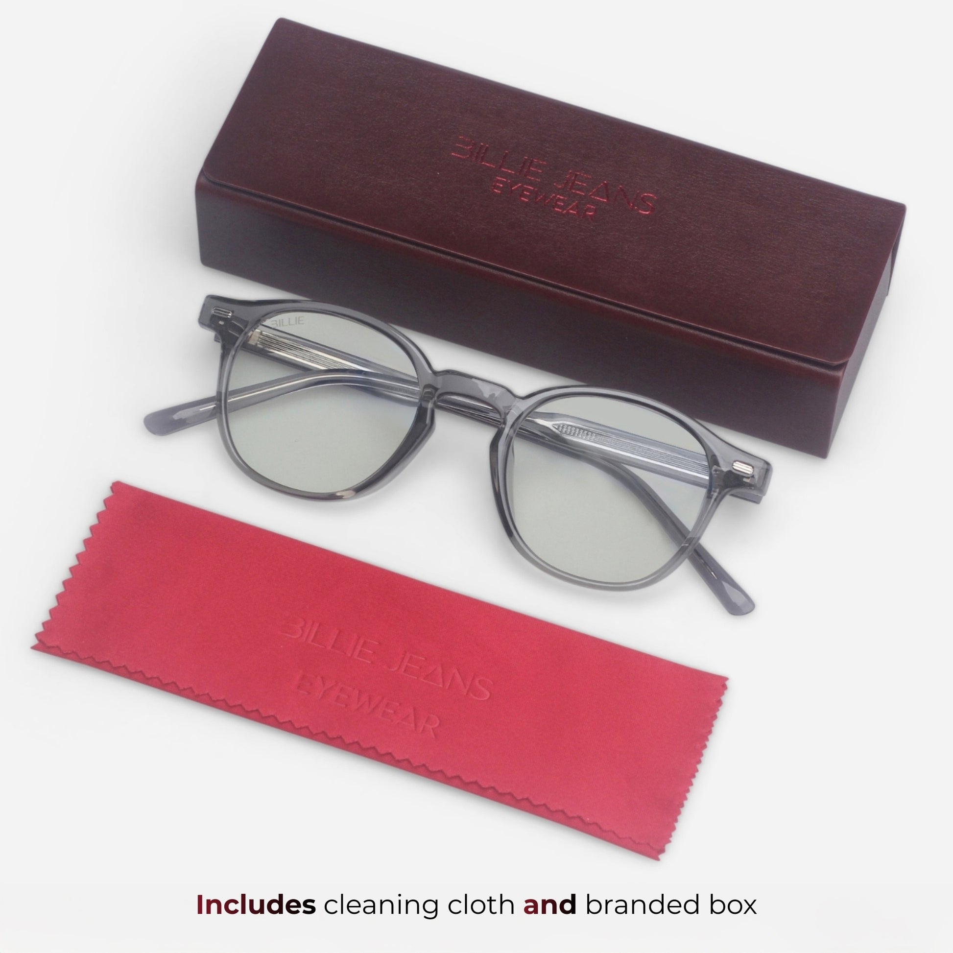 Round eyeglasses with branded cleaning cloth and box on a white background