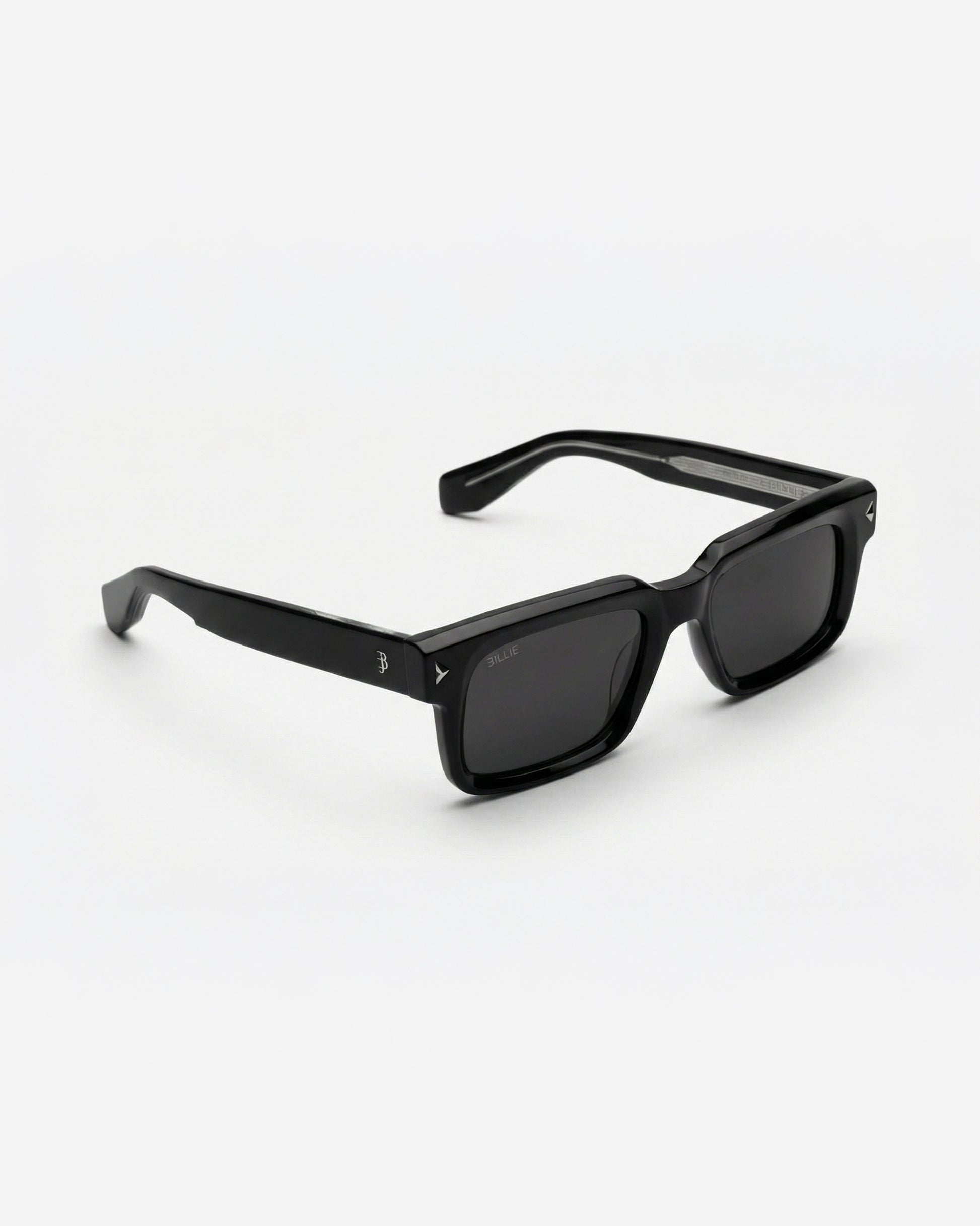 Black sunglasses with square frames on a plain background