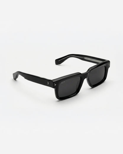 Black sunglasses with square frames on a plain background