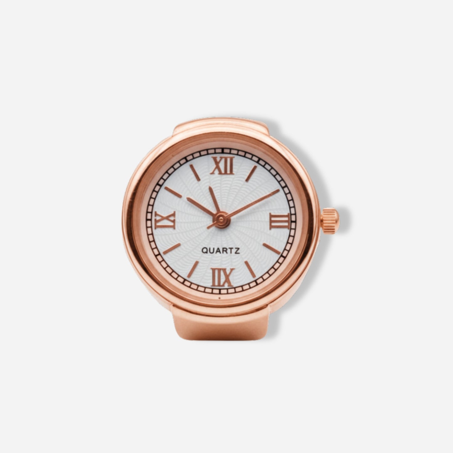 Rose gold ring watch with white face and Roman numerals on a light gray background