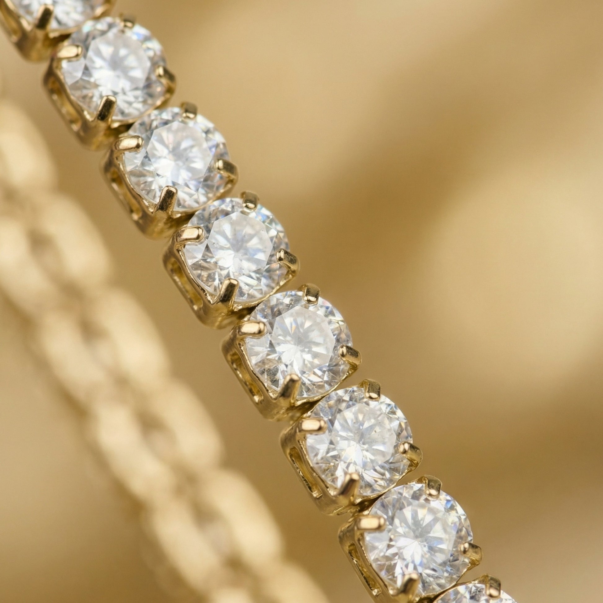 Close-up of a gold bracelet with diamonds on a blurred gold background