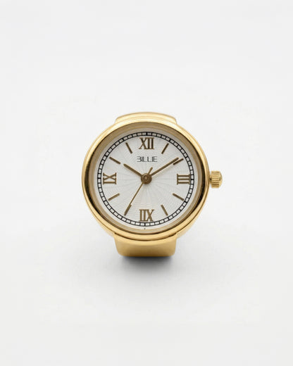 Gold watch with white face and Roman numerals on a plain background