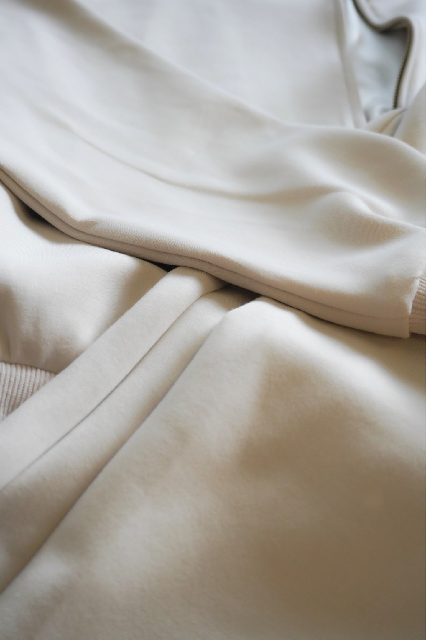 Close-up of beige fabric with a focus on texture and color.