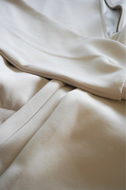 Close-up of beige fabric with a focus on texture and color.