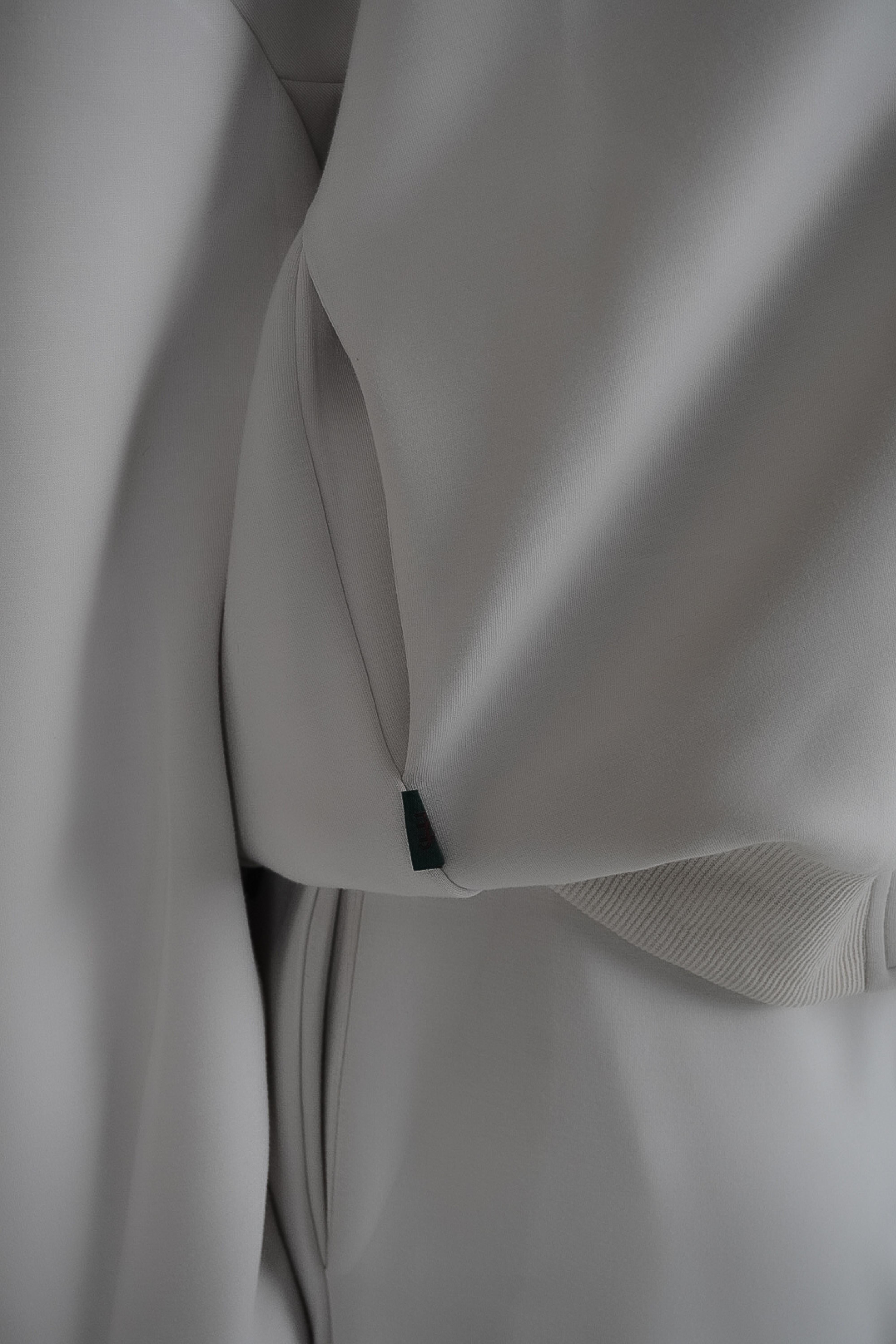 Close-up of a light gray fabric with a textured pattern