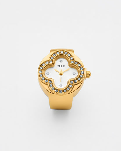 Gold watch with a white face and crystal accents on a plain background.