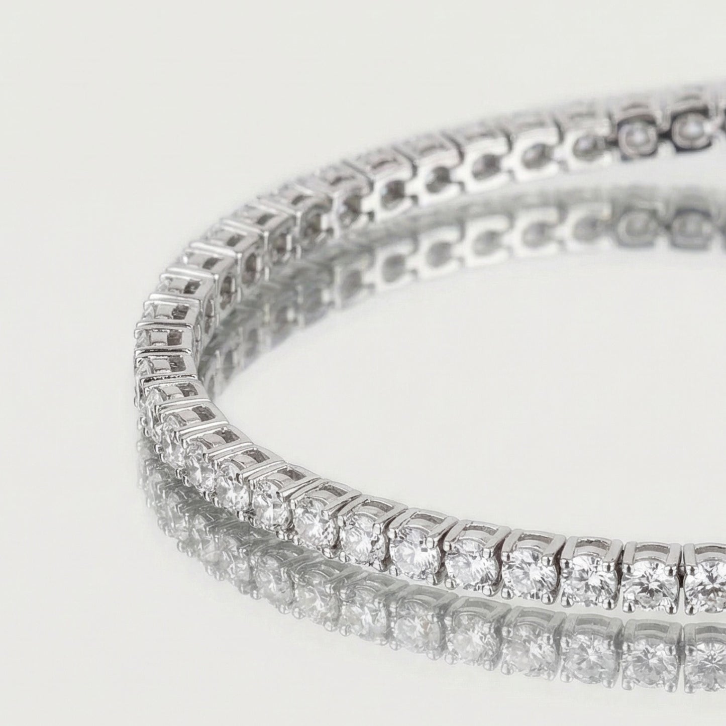 Close-up of a diamond bracelet on a light gray background