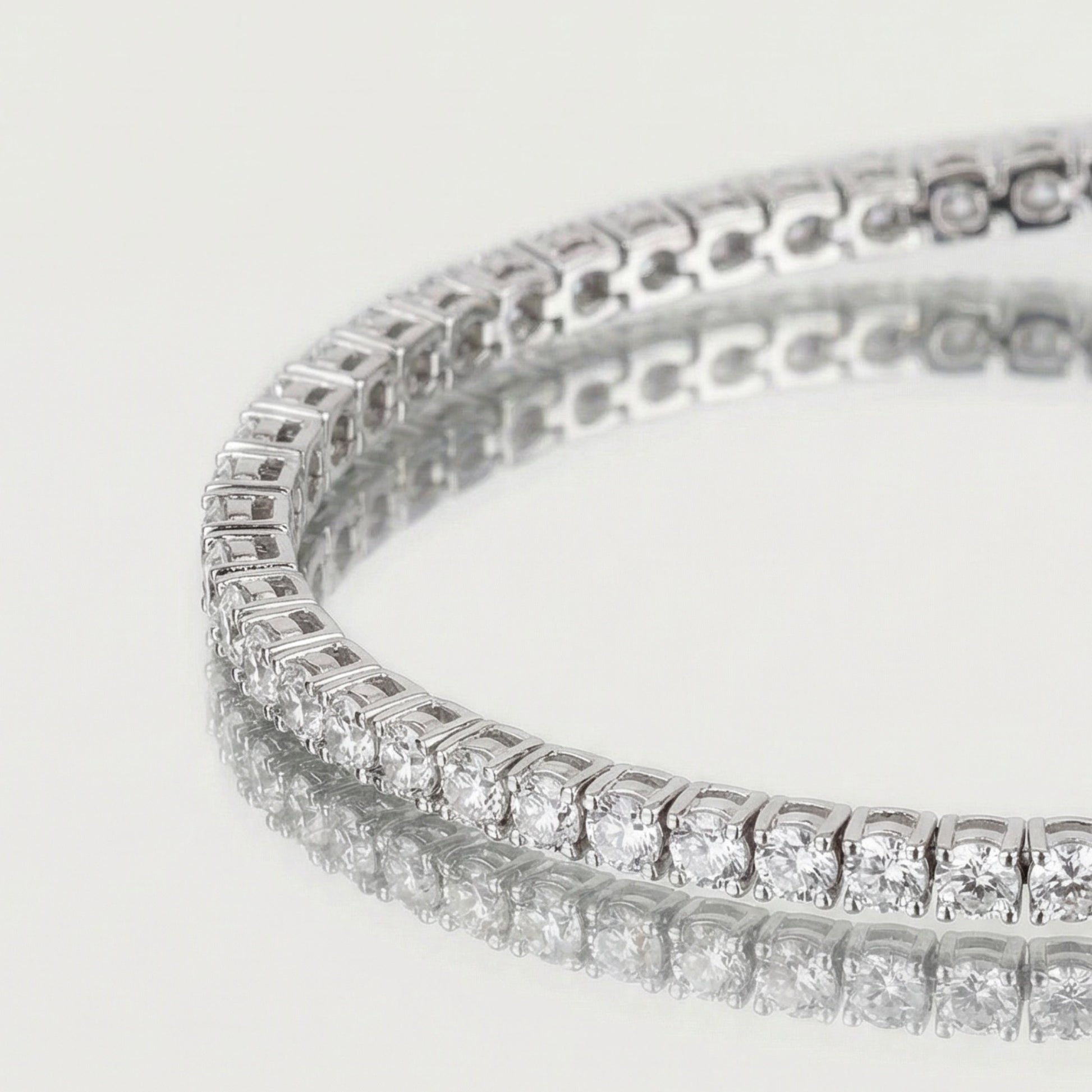 Close-up of a diamond bracelet on a light gray background