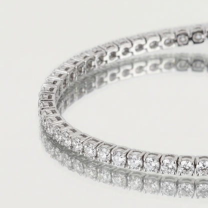 Close-up of a diamond bracelet on a light gray background