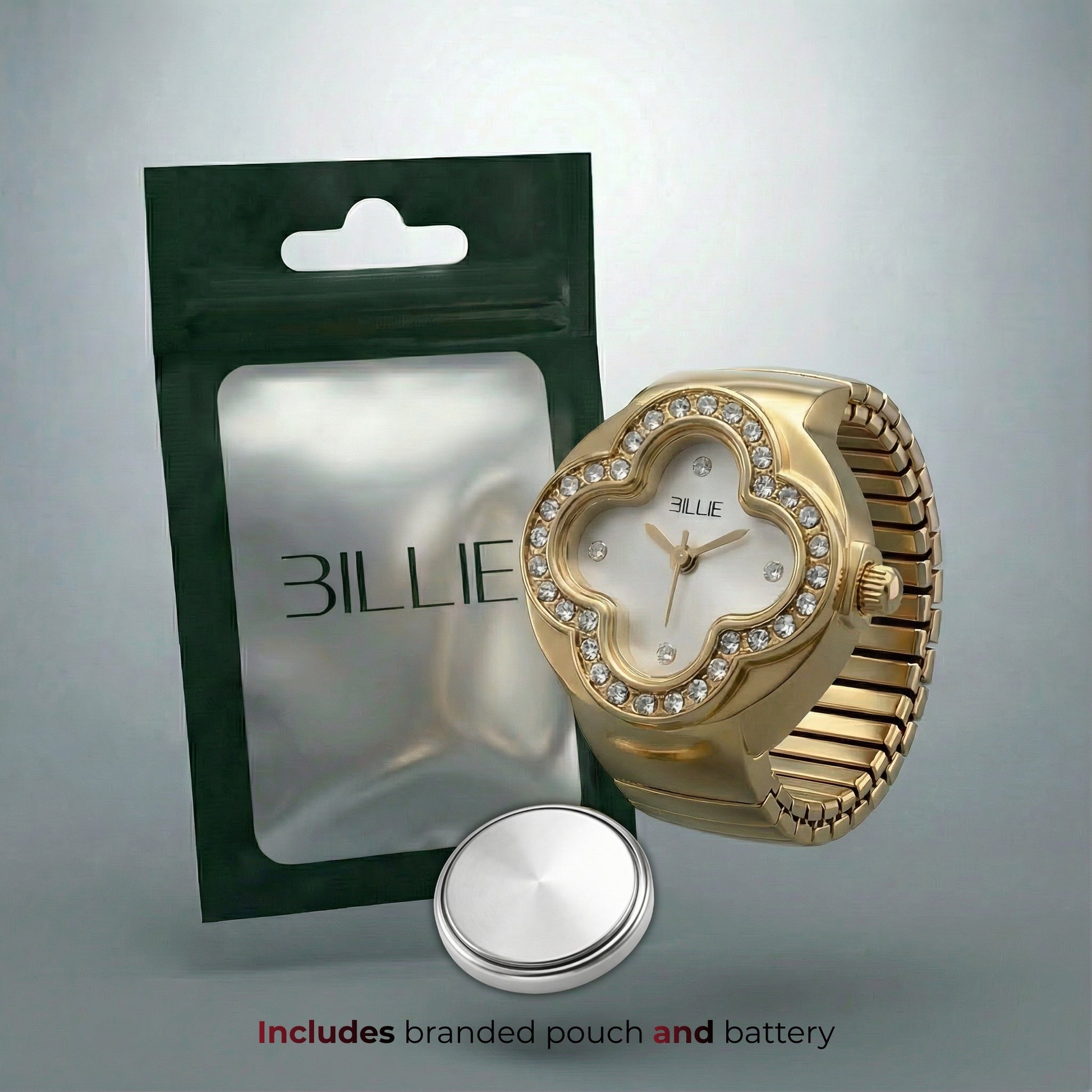 Gold watch with branded pouch and battery on a gray background