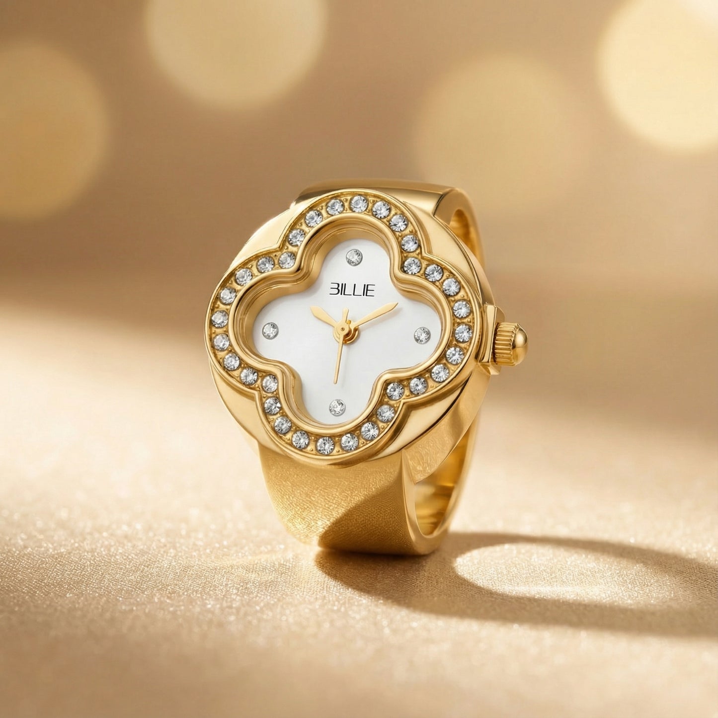 Gold watch with diamond accents on a gold background