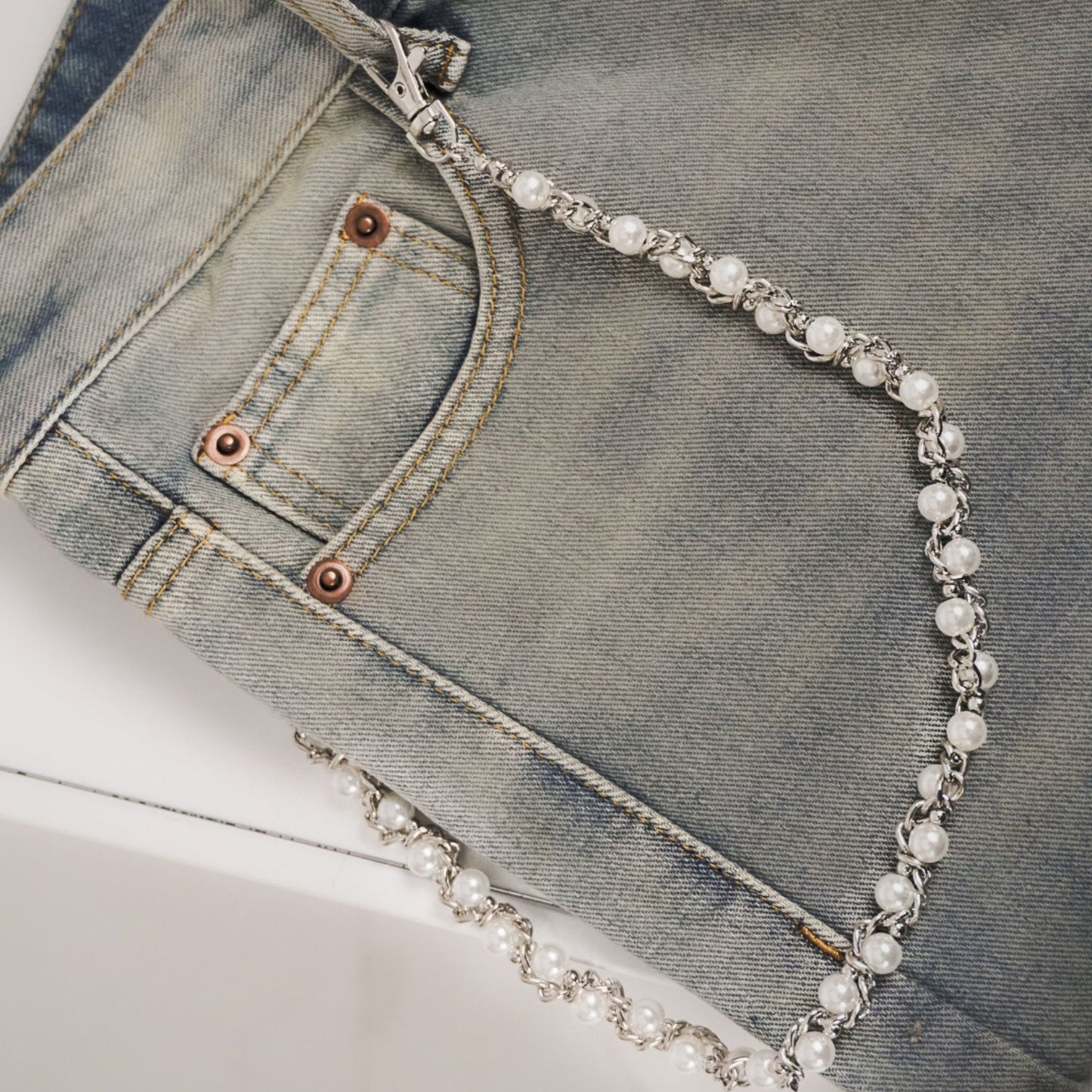 jeans chain draped over a pair of jeans