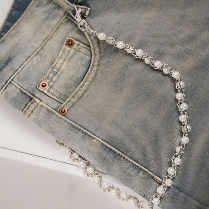 jeans chain draped over a pair of jeans