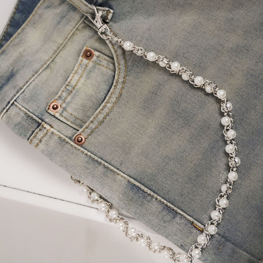 jeans chain draped over a pair of jeans