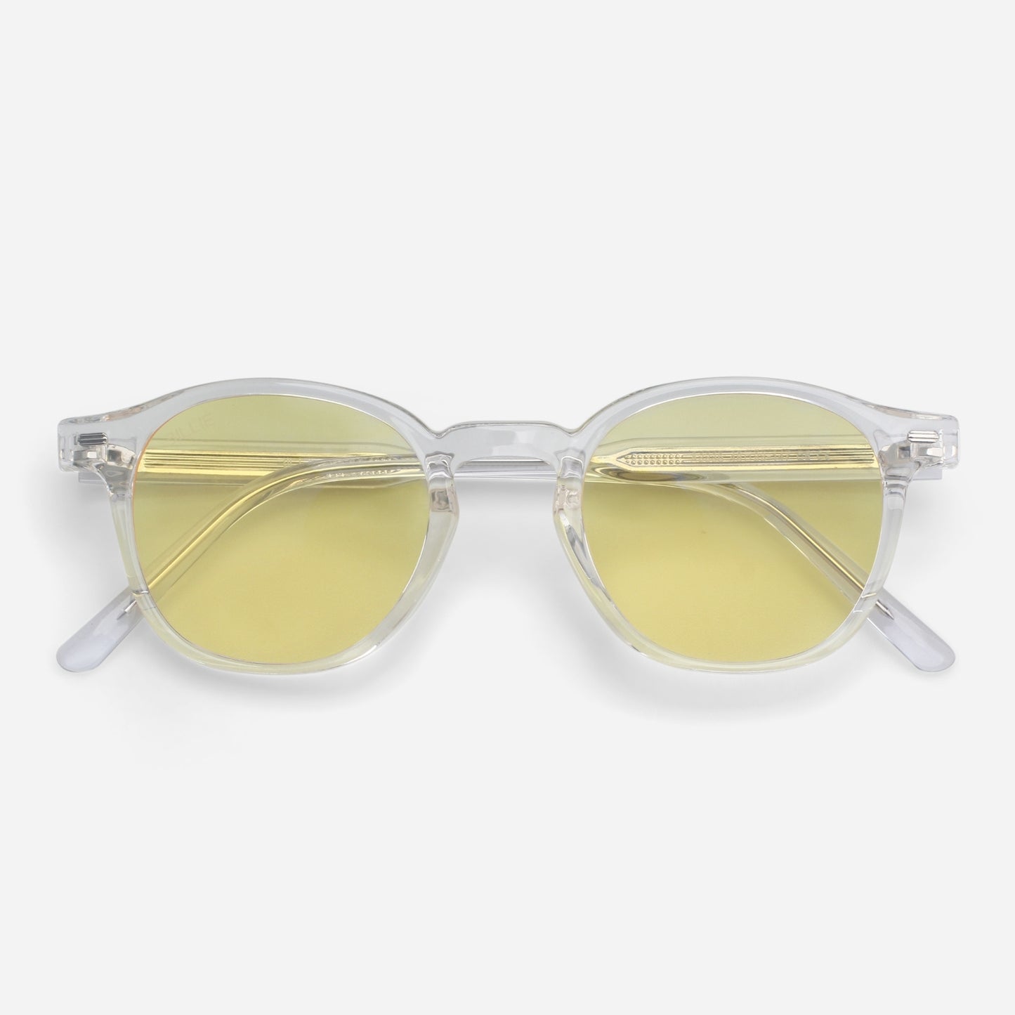 Clear frame Blue light glasses with yellow lenses on a white background