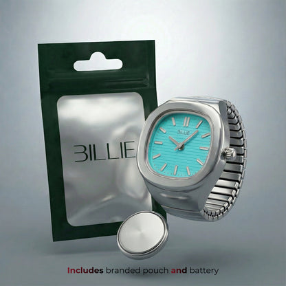 Silver watch with turquoise face and branded pouch on a gray background