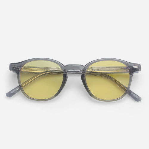 Round Blue light glasses with yellow lenses and gray frames on a white background