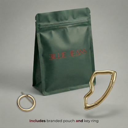 Green branded pouch with gold key ring on a gray background