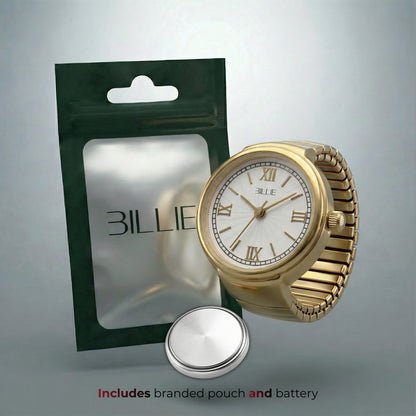 Gold wristwatch with branded pouch and battery on a gray background