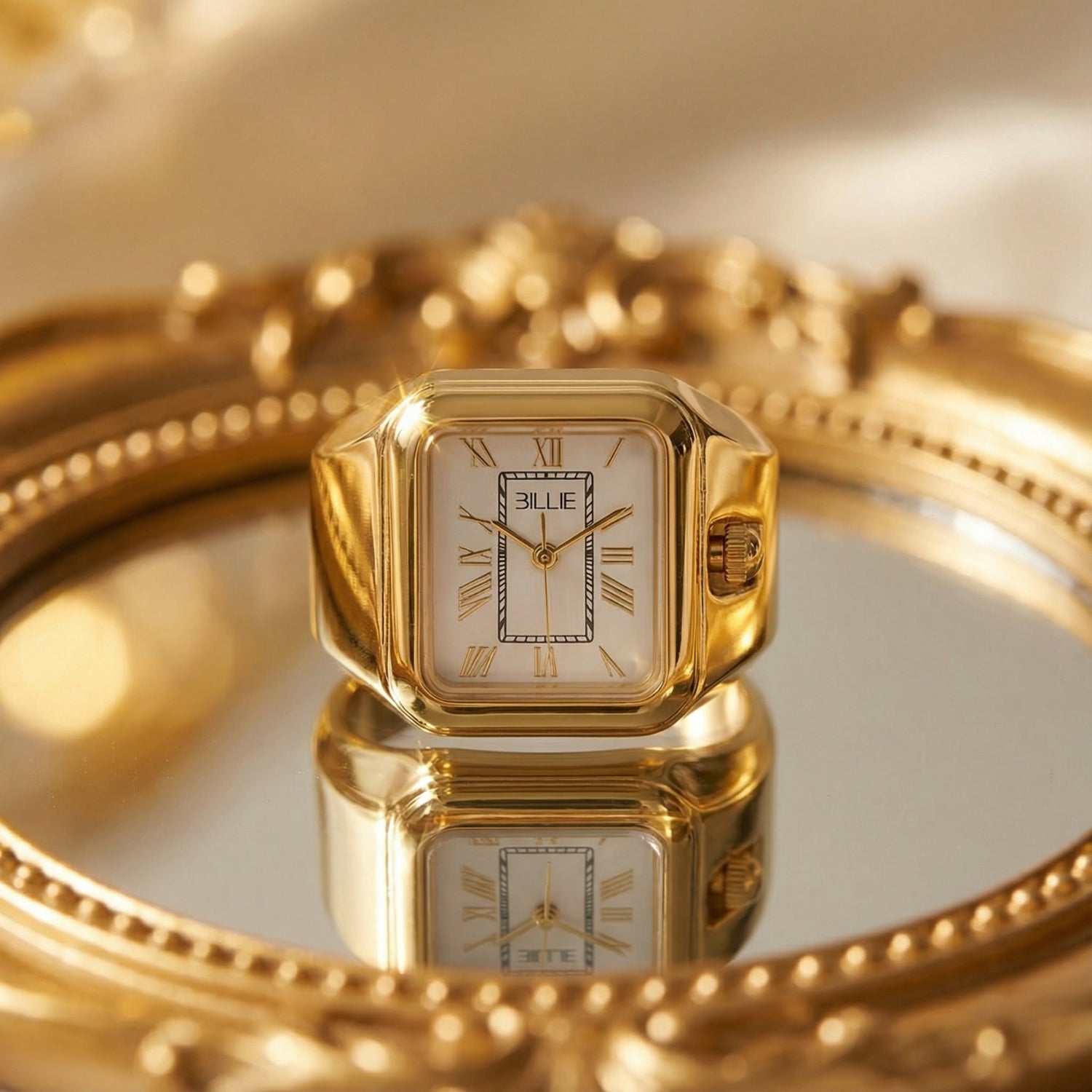 Gold watch with a reflective surface