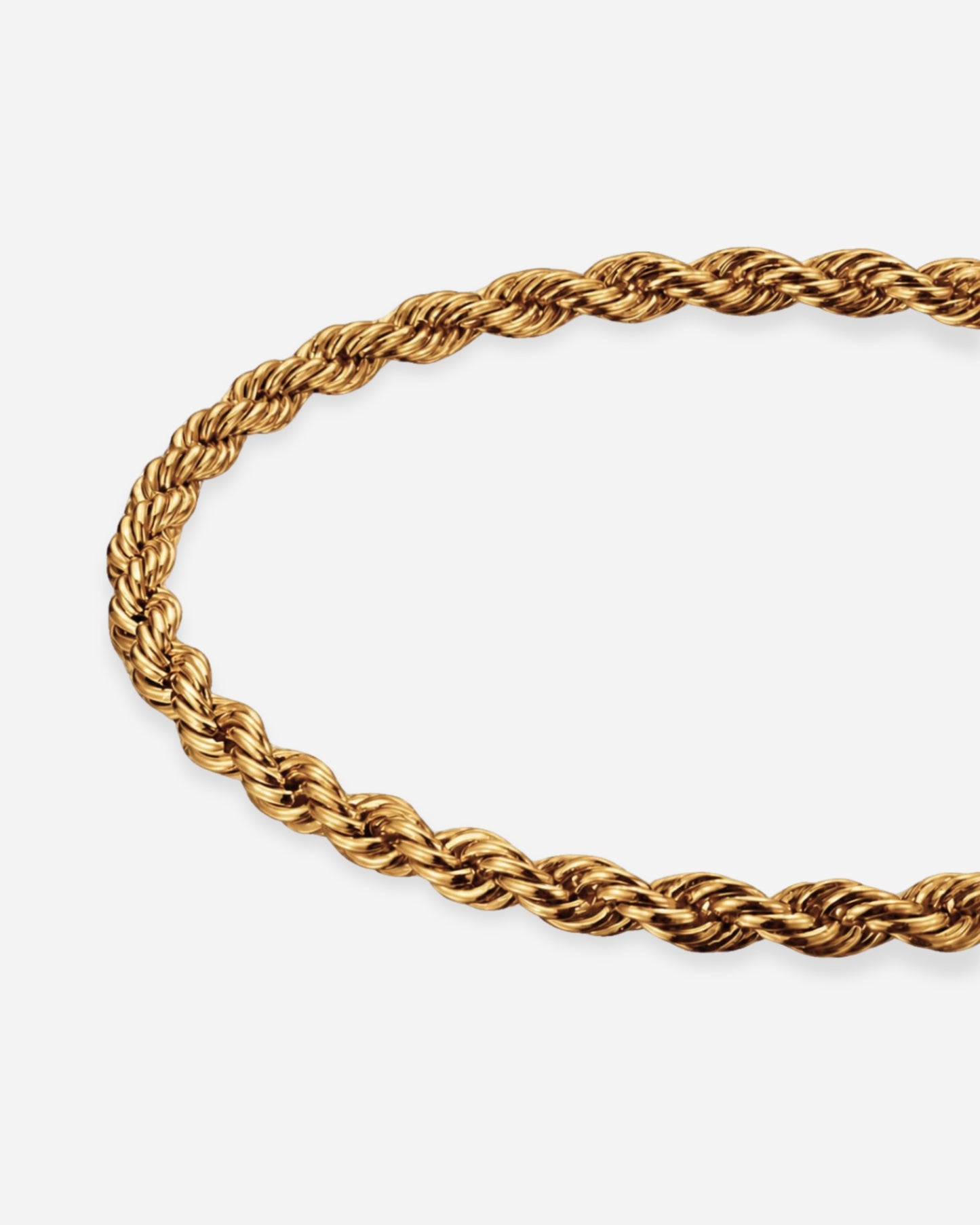 Twisted gold chain necklace on a plain white background