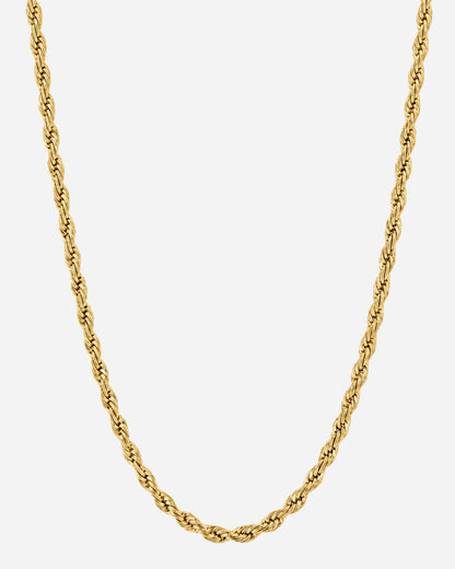 Twisted gold chain necklace on a plain background