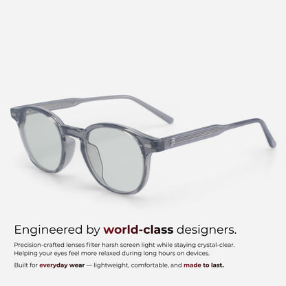 Sunglasses with a clear lens on a white background, featuring text about world-class design and screen light filtering.